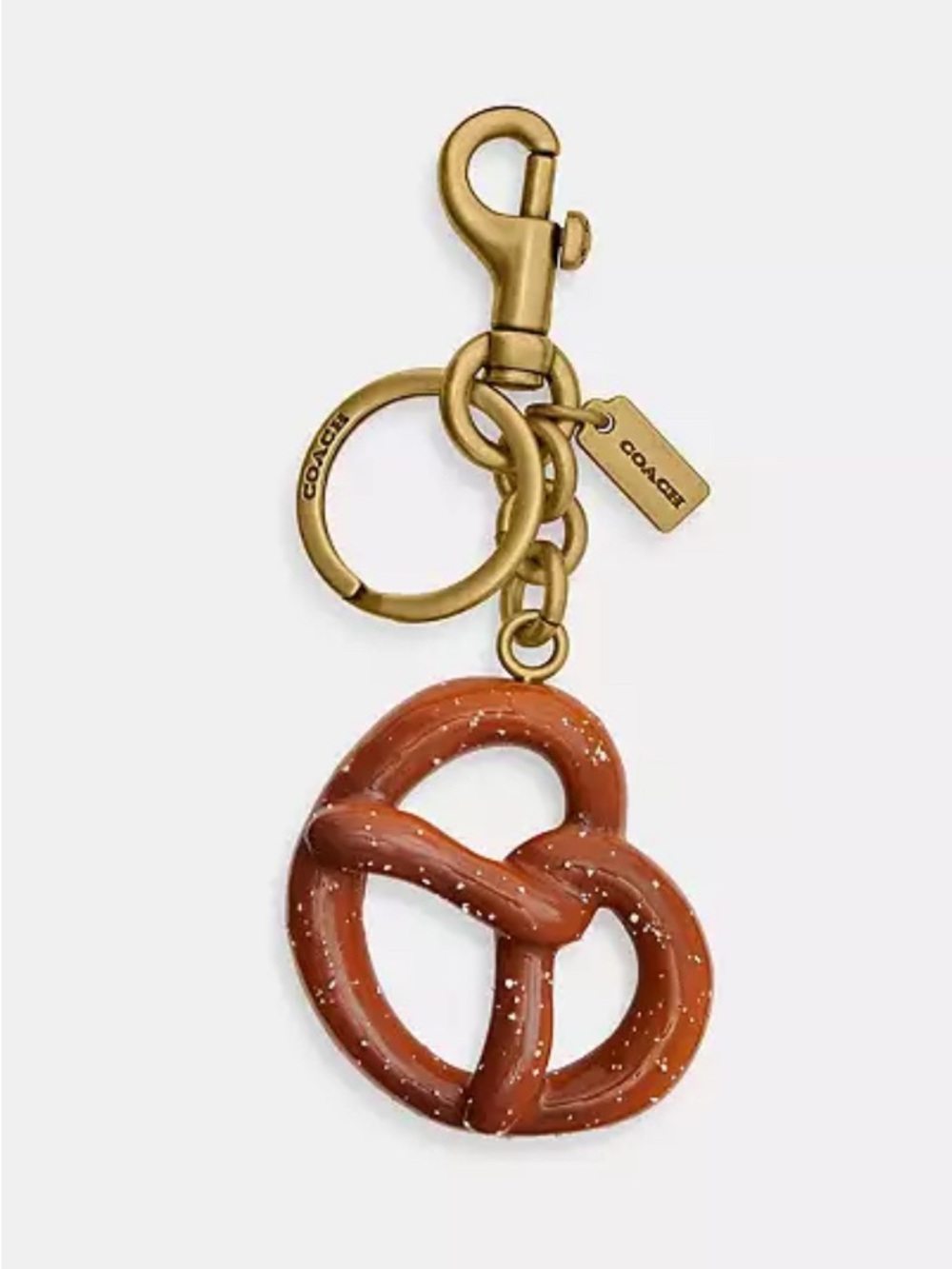 HOT!!!! Coach Gold-Tone Pretzel Purse Charm in Brown. NWT and Dusty